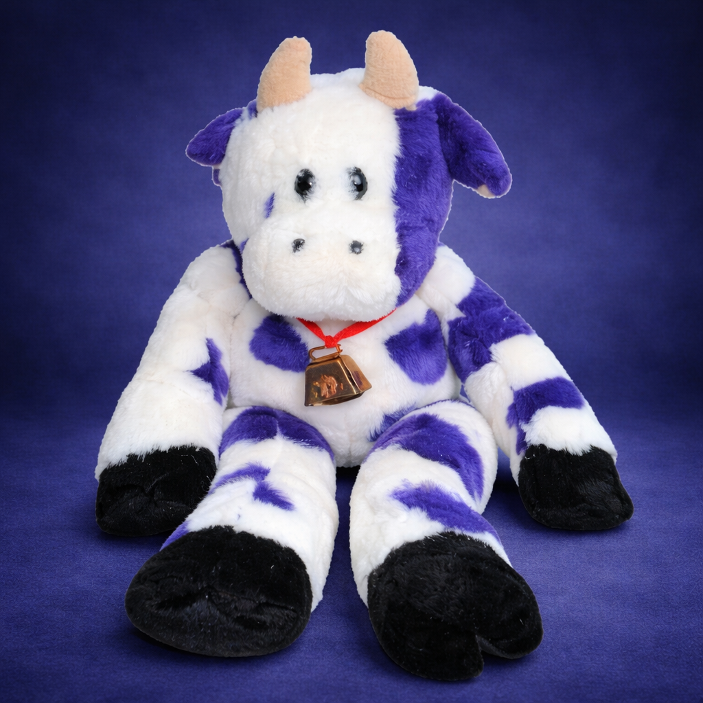 custom plush cow sitting on purple background